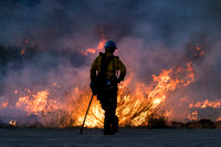Firefighter watching flames